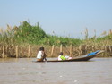 Boy riding low in inle boat