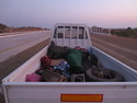 Brad sleeping in the back of a truck