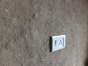 Electrical outlet on mud and straw wall