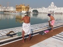 Guys bathing at golden temple