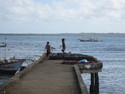 Kids playing on dock in puerto princesa