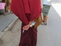 Monk holding a cigarette