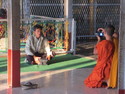 Monk taking a picture of somebody