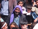 Old man with purple head scarf