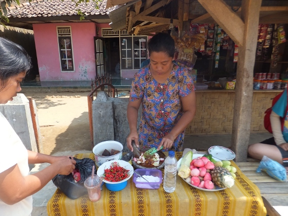 Woman at Sawarna making sweet and spicy fruit and vegetables