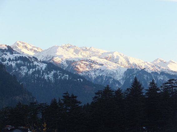 Sunset on the mountains across they valley from Manali