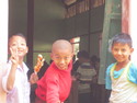Three boys in village outside mandalay