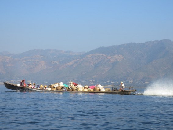 Boat carrying goods and locals in Inle Lake
