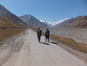 Walter and edson walking in no mans land between kyrgyzstan and tajikistan