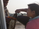Woman refilling gas enroute to mandalay